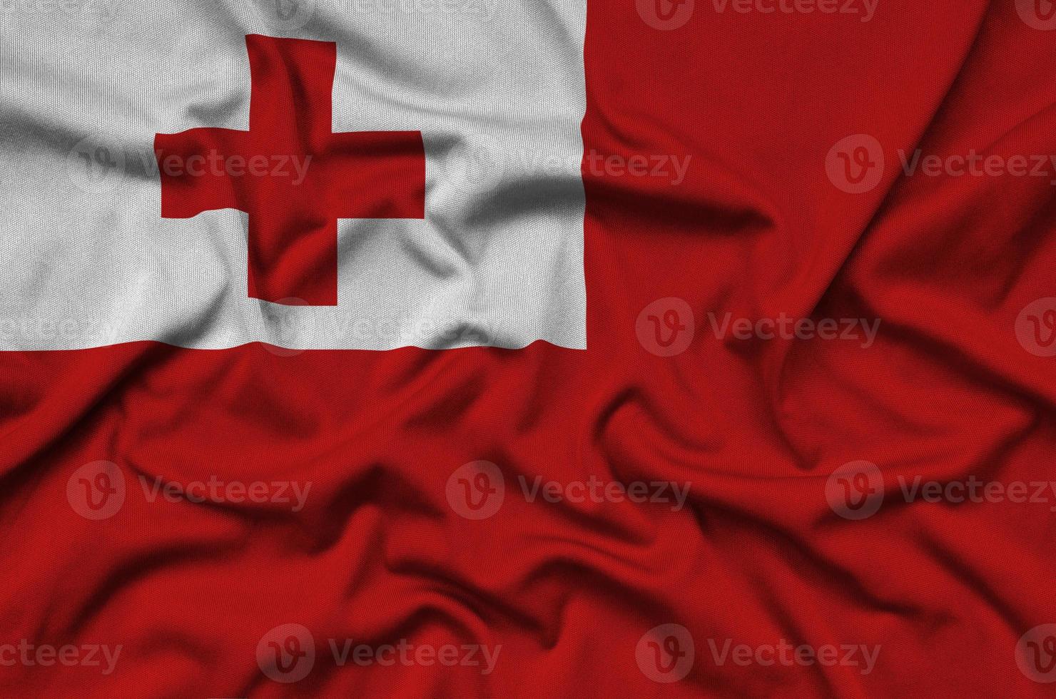 Tonga flag  is depicted on a sports cloth fabric with many folds. Sport team banner photo