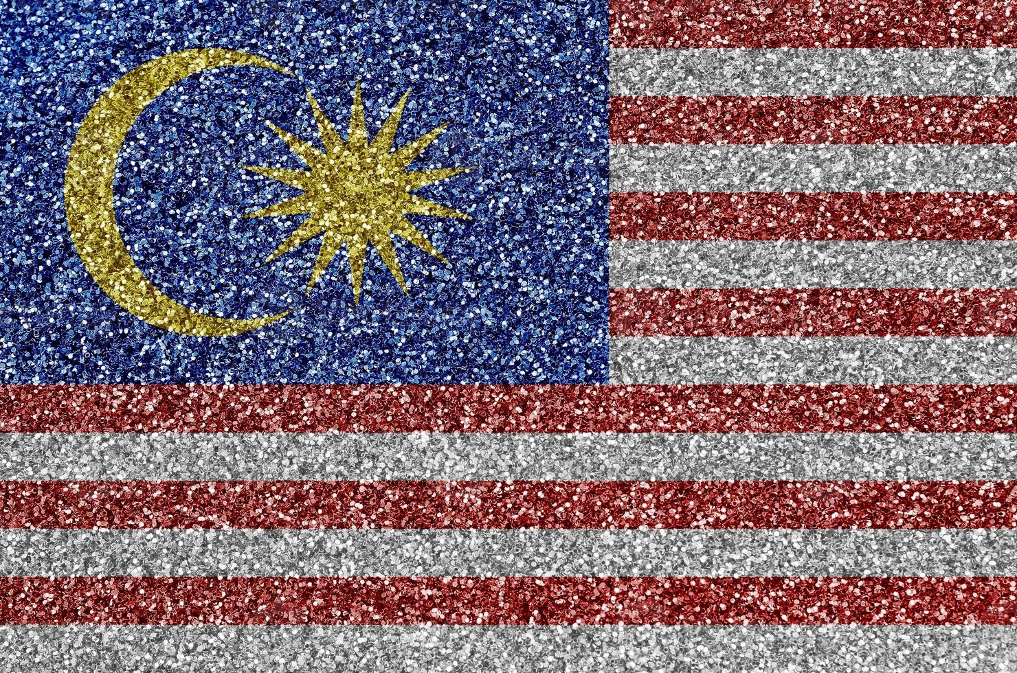 Malaysia flag depicted on many small shiny sequins. Colorful festival background for party photo