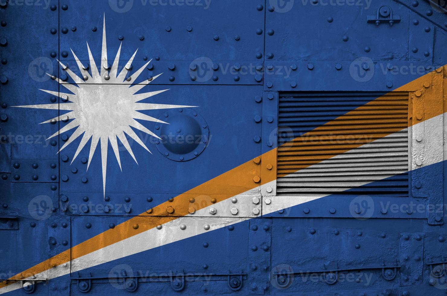 Marshall Islands flag depicted on side part of military armored tank closeup. Army forces conceptual background photo