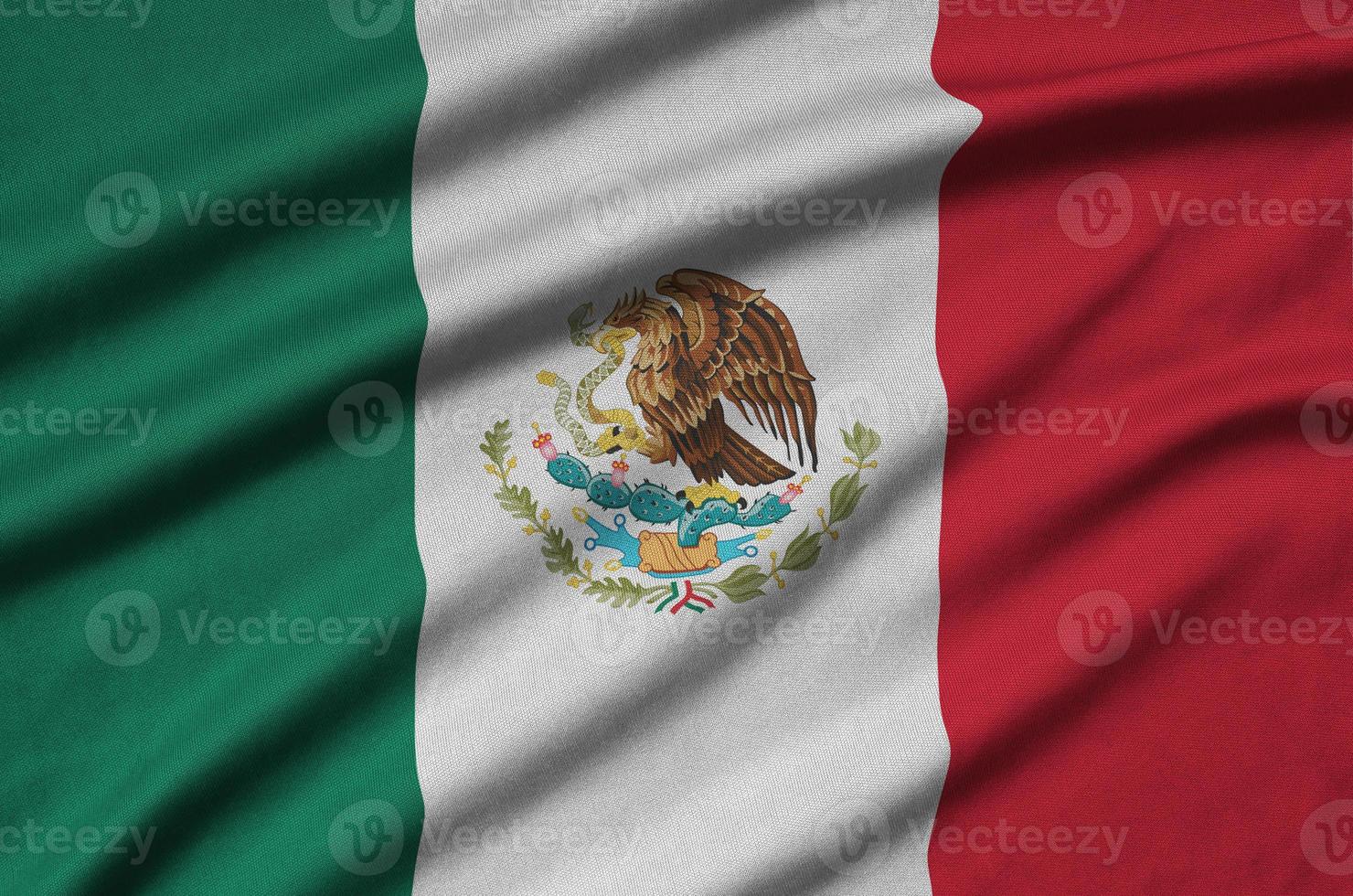 Mexico flag  is depicted on a sports cloth fabric with many folds. Sport team banner photo