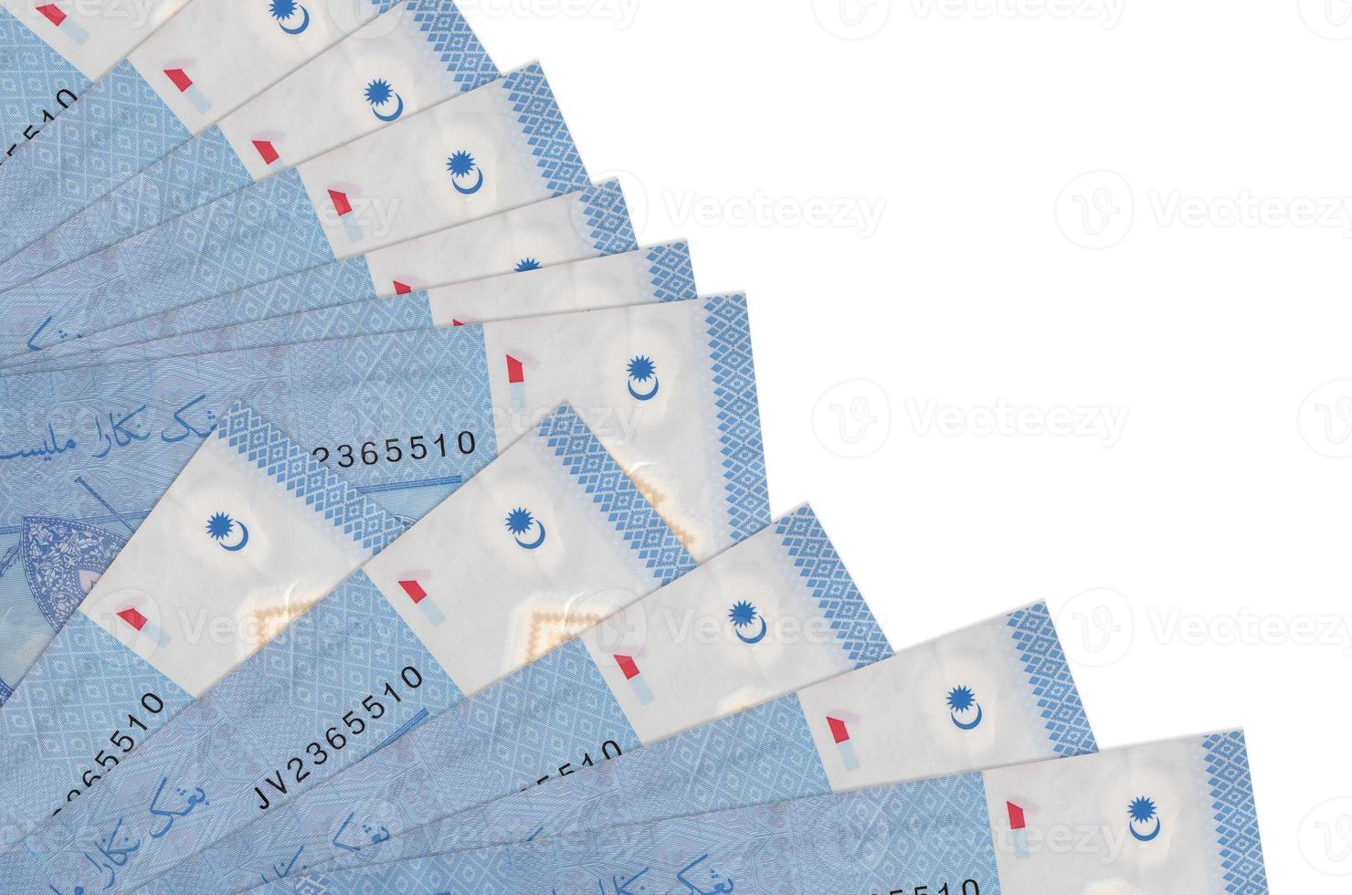 1 Malaysian ringgit bills lies isolated on white background with copy space stacked in fan close up photo
