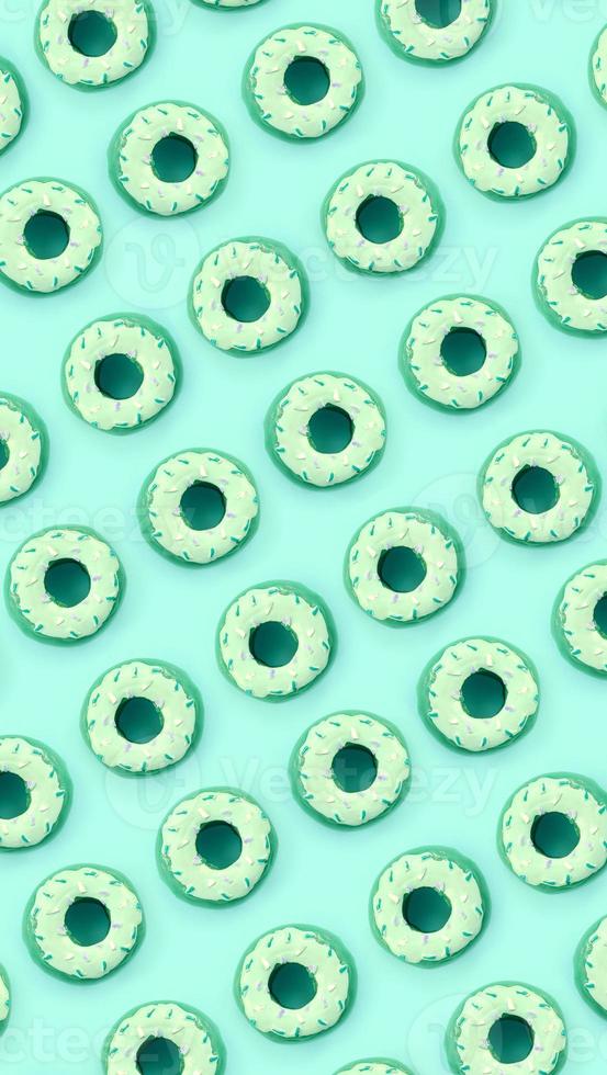 Many small plastic donuts lies on a pastel colorful background. Flat lay minimal pattern. Top view photo