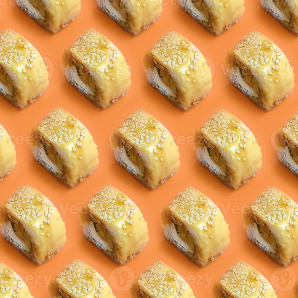 Tori Katsu sushi Rolls Maki with processed cheese on orange background. Minimalism top view flat lay pattern with Japanese food photo