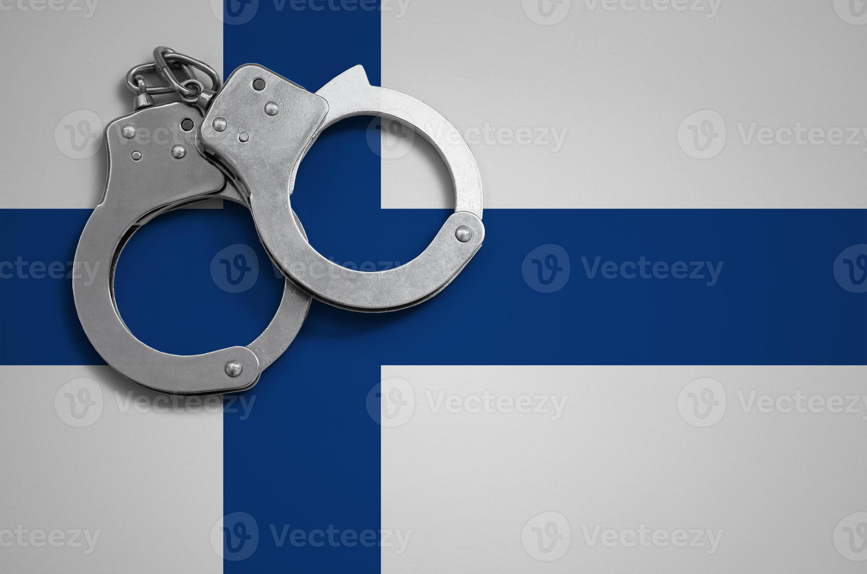 Finland flag and police handcuffs. The concept of crime and offenses in