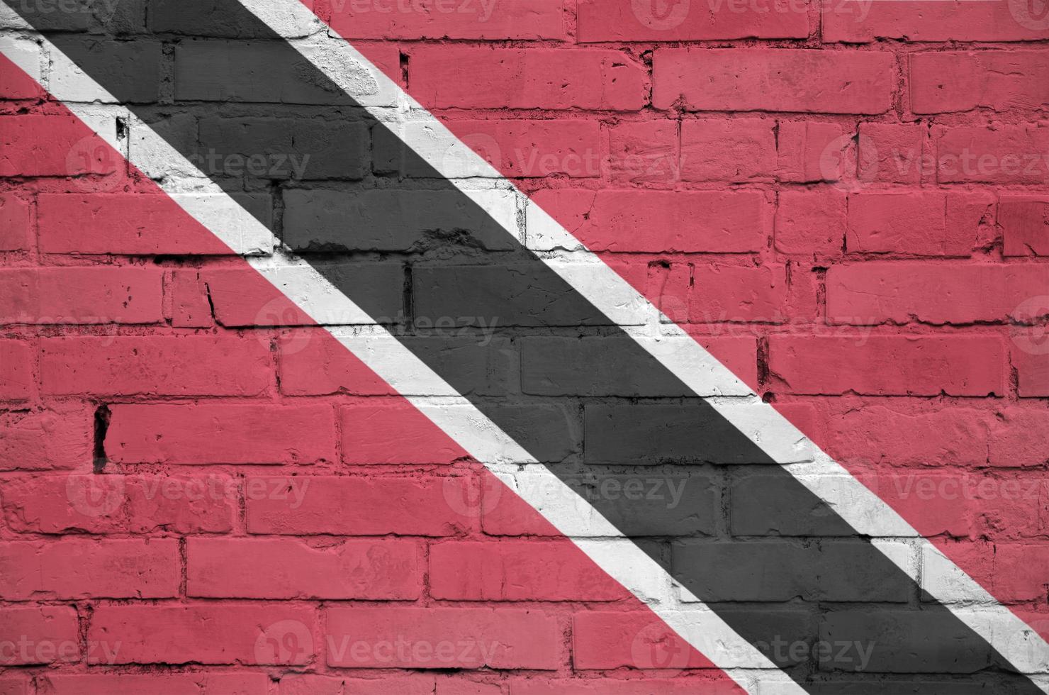 Trinidad and Tobago flag is painted onto an old brick wall photo