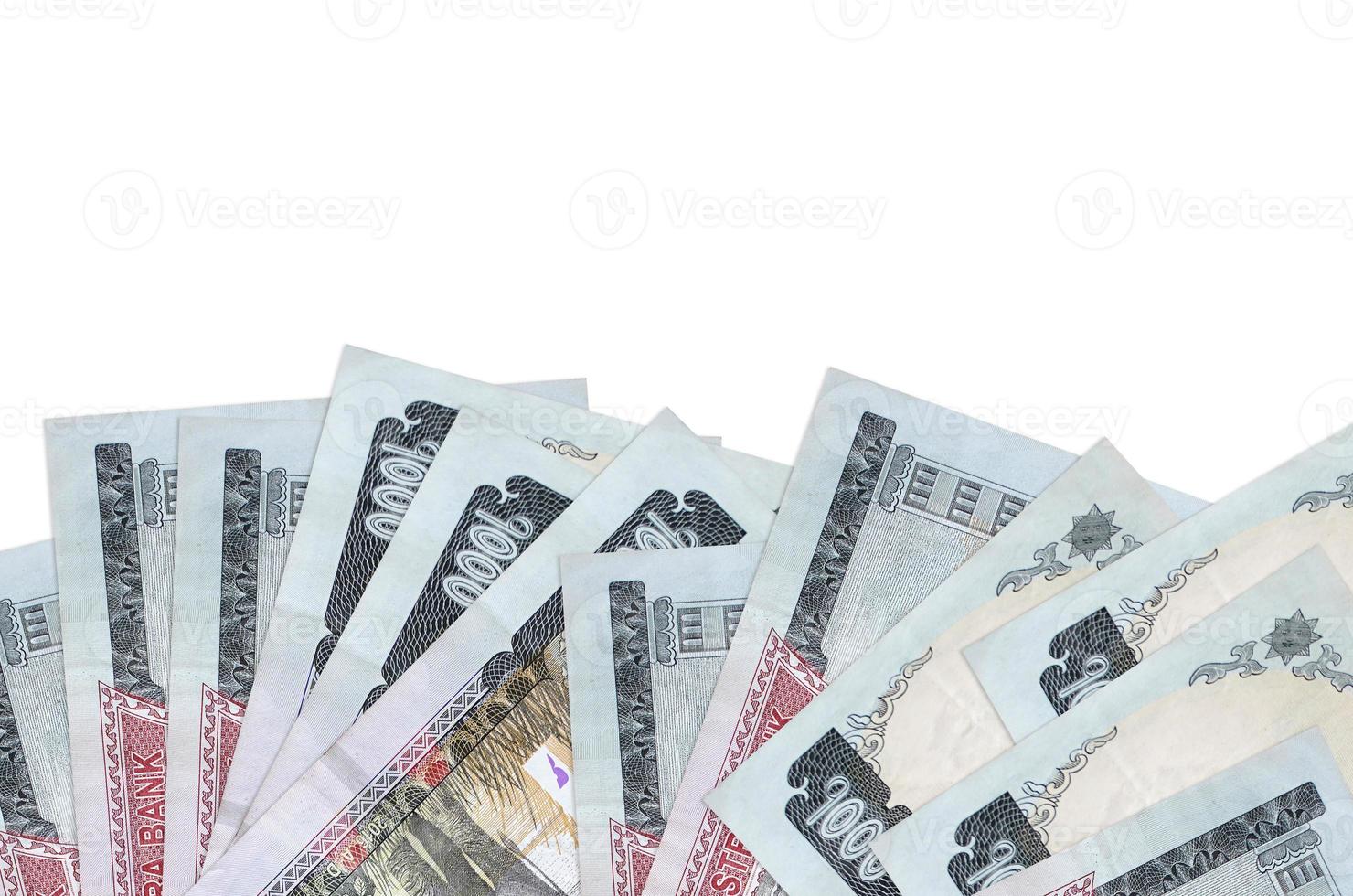 1000 Nepalese rupees bills lies on bottom side of screen isolated on white background with copy space. Background banner template photo