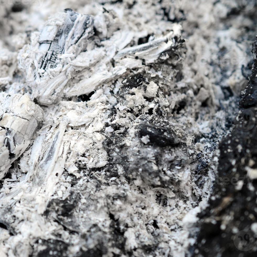 Pile of ashes after the fire went out grunge background texture photo