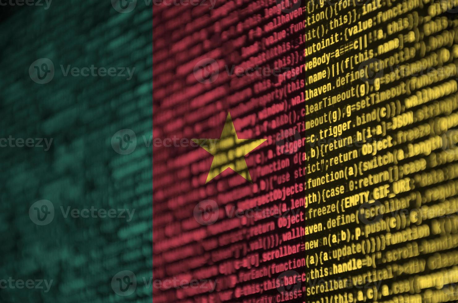Cameroon flag  is depicted on the screen with the program code. The concept of modern technology and site development photo