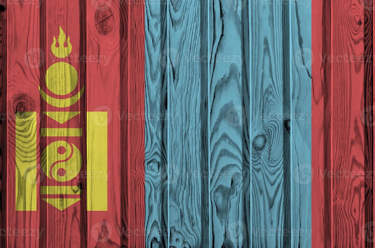 Mongolia flag depicted in bright paint colors on old wooden wall. Textured banner on rough background photo