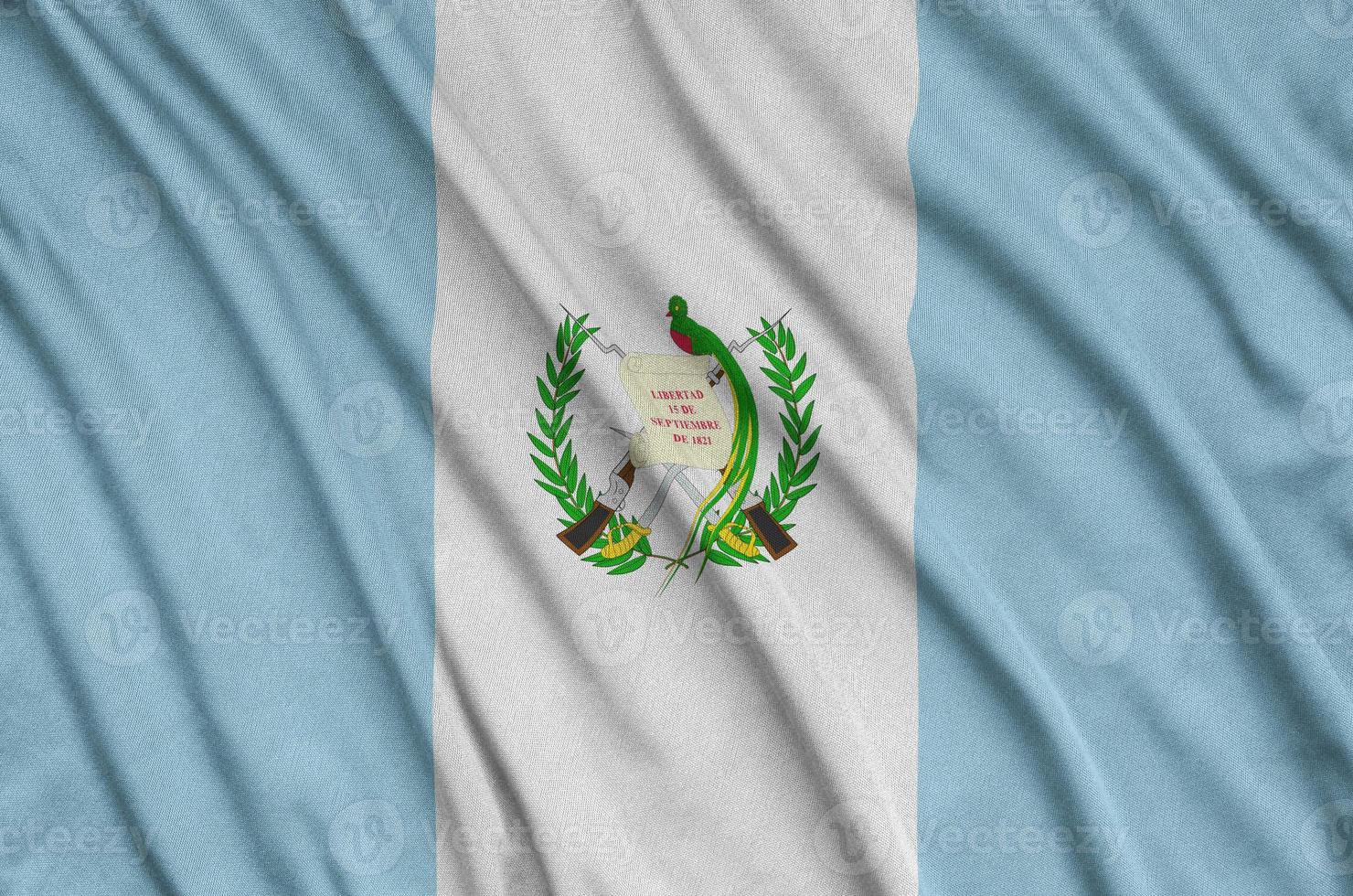 Guatemala flag  is depicted on a sports cloth fabric with many folds. Sport team banner photo