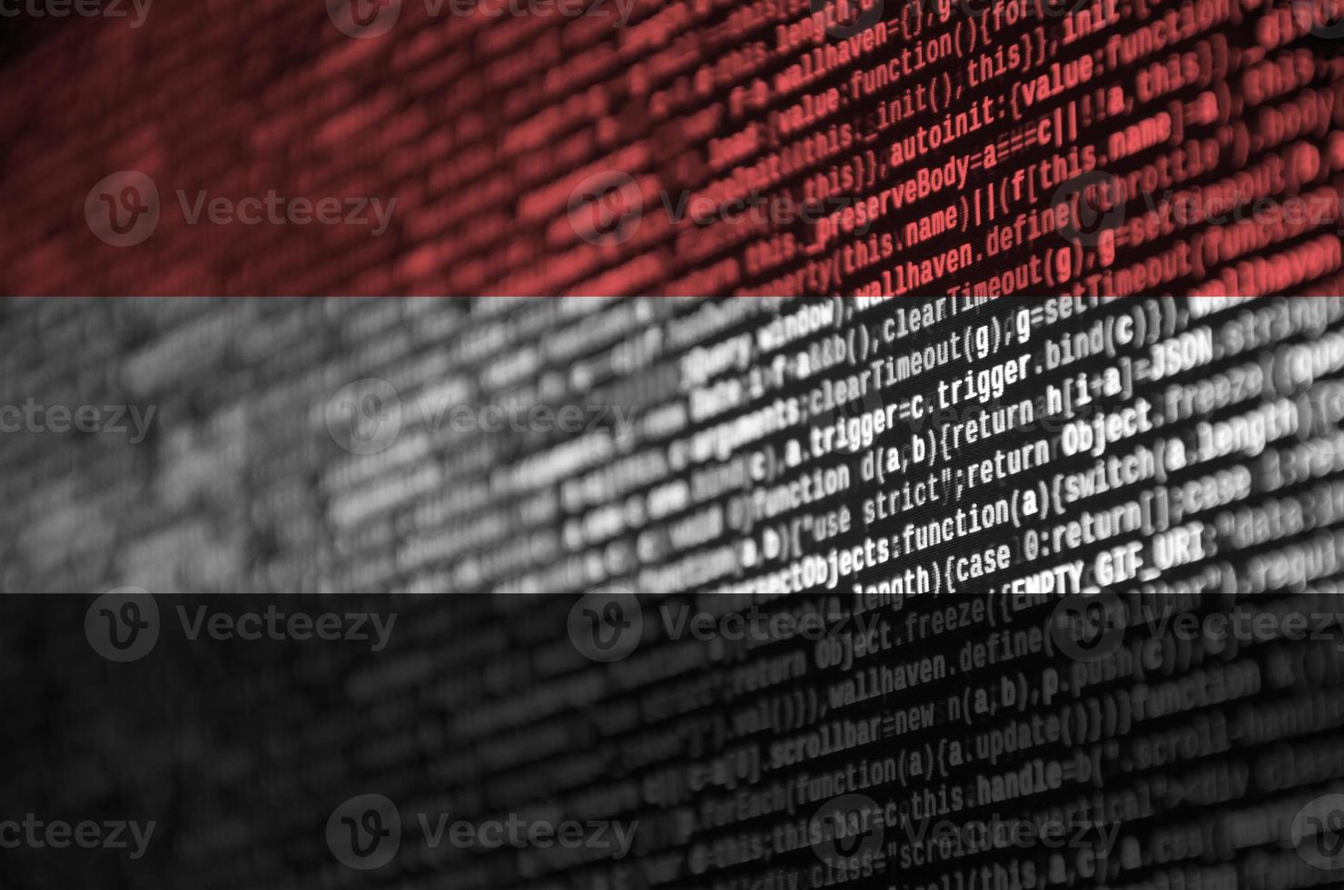 Yemen flag  is depicted on the screen with the program code. The concept of modern technology and site development photo