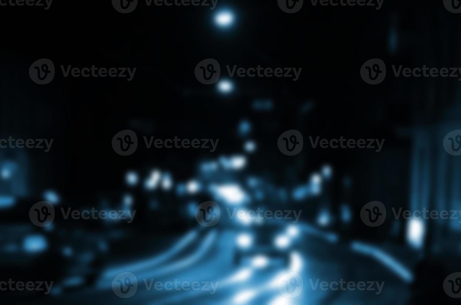 Blurred night scene of traffic on the roadway. Defocused image of cars traveling with luminous headlights. Bokeh Art photo