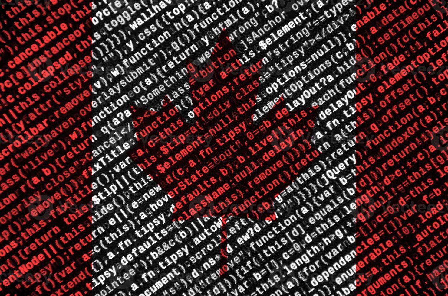 Canada flag  is depicted on the screen with the program code. The concept of modern technology and site development photo