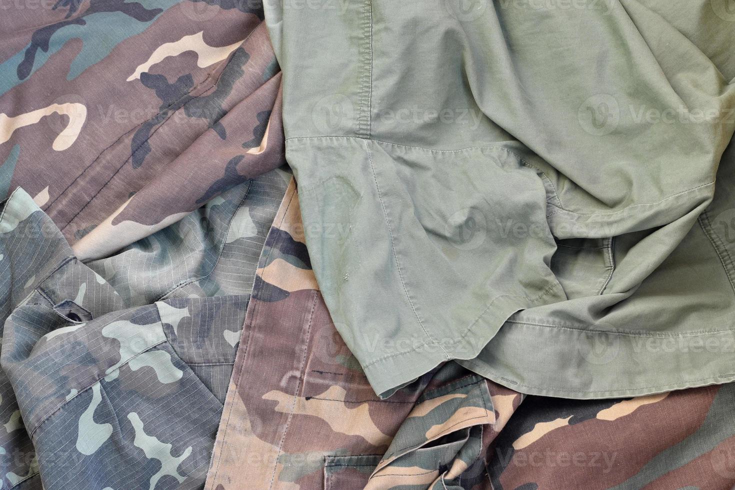 Camouflage background texture as backdrop for army and military design projects photo