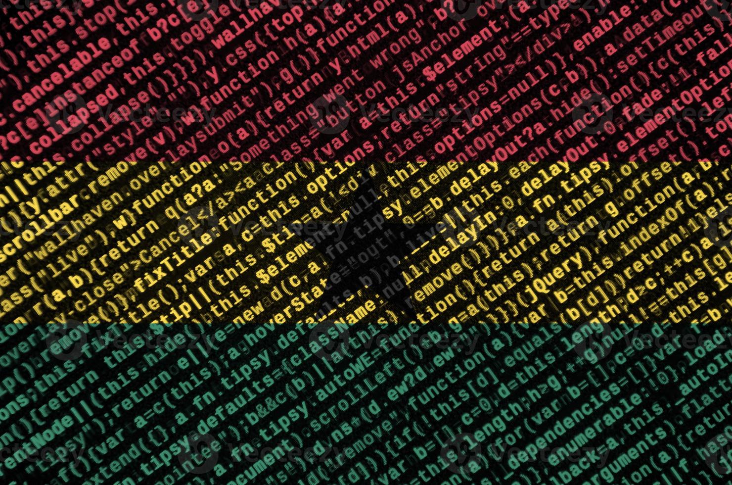 Ghana flag  is depicted on the screen with the program code. The concept of modern technology and site development photo