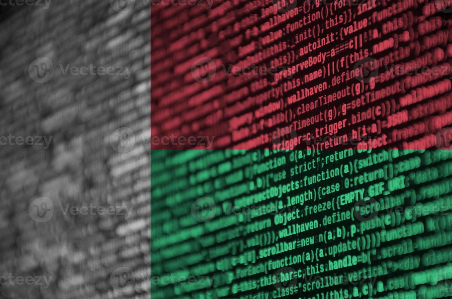 Madagascar flag  is depicted on the screen with the program code. The concept of modern technology and site development photo