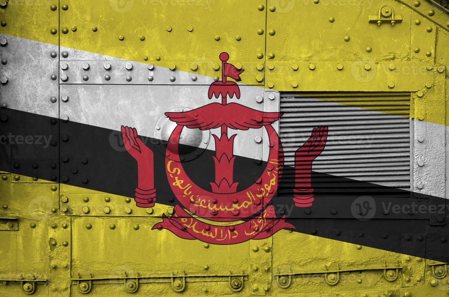 Brunei Darussalam flag depicted on side part of military armored tank closeup. Army forces conceptual background photo