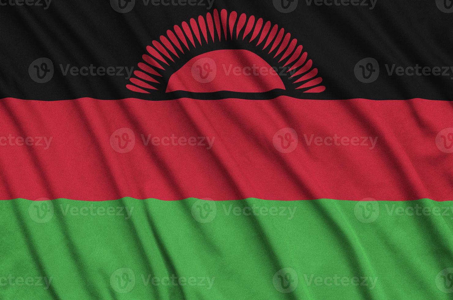 Malawi flag  is depicted on a sports cloth fabric with many folds. Sport team banner photo