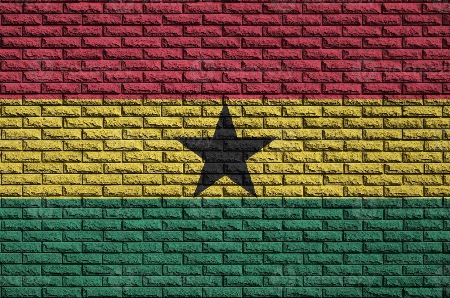 Ghana flag is painted onto an old brick wall photo