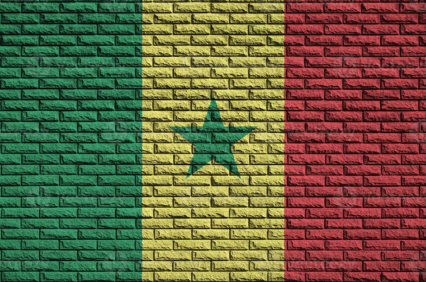 Senegal flag is painted onto an old brick wall photo