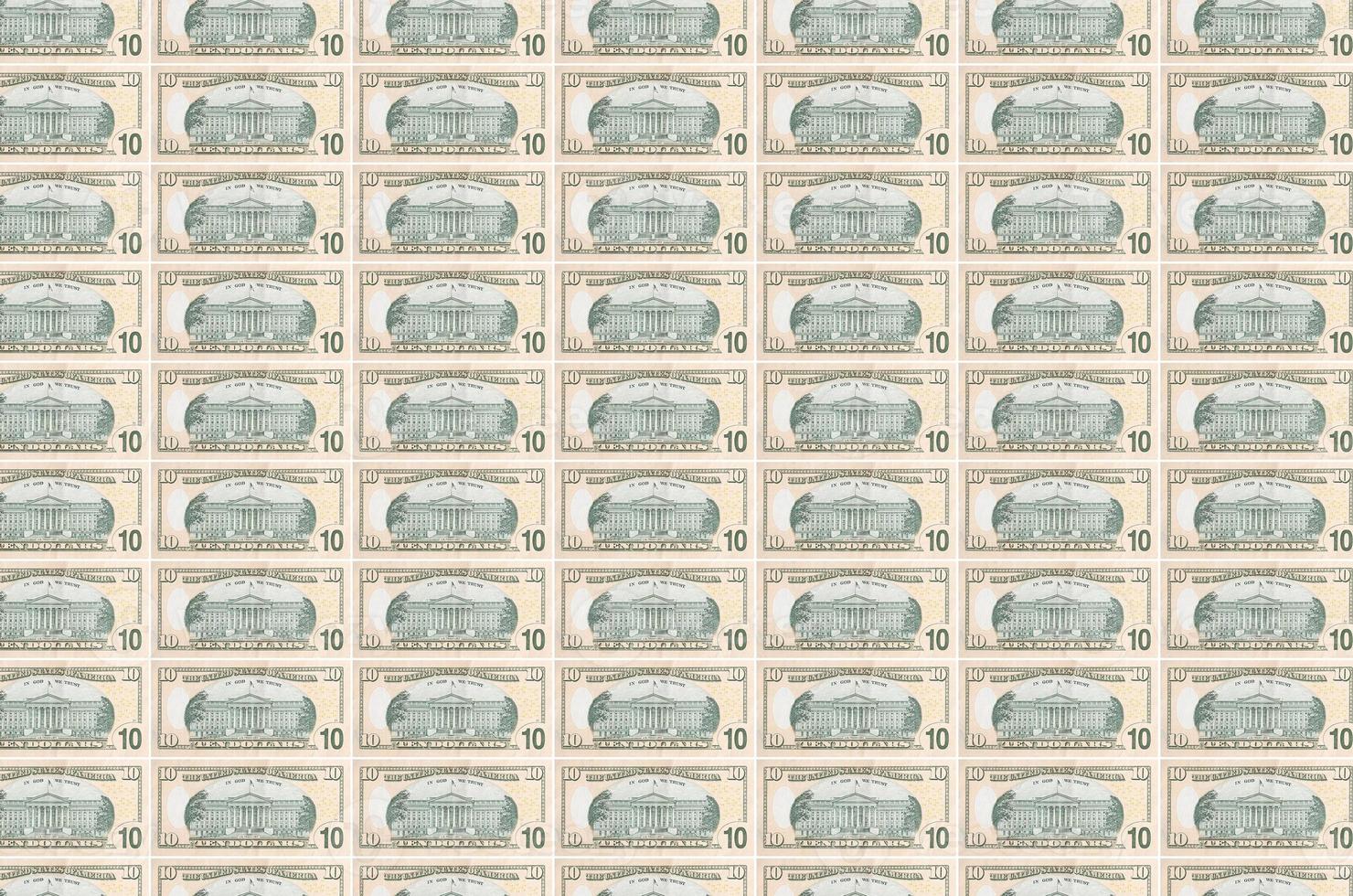 10 US dollars bills printed in money production conveyor. Collage of many bills. Concept of currency devaluation photo