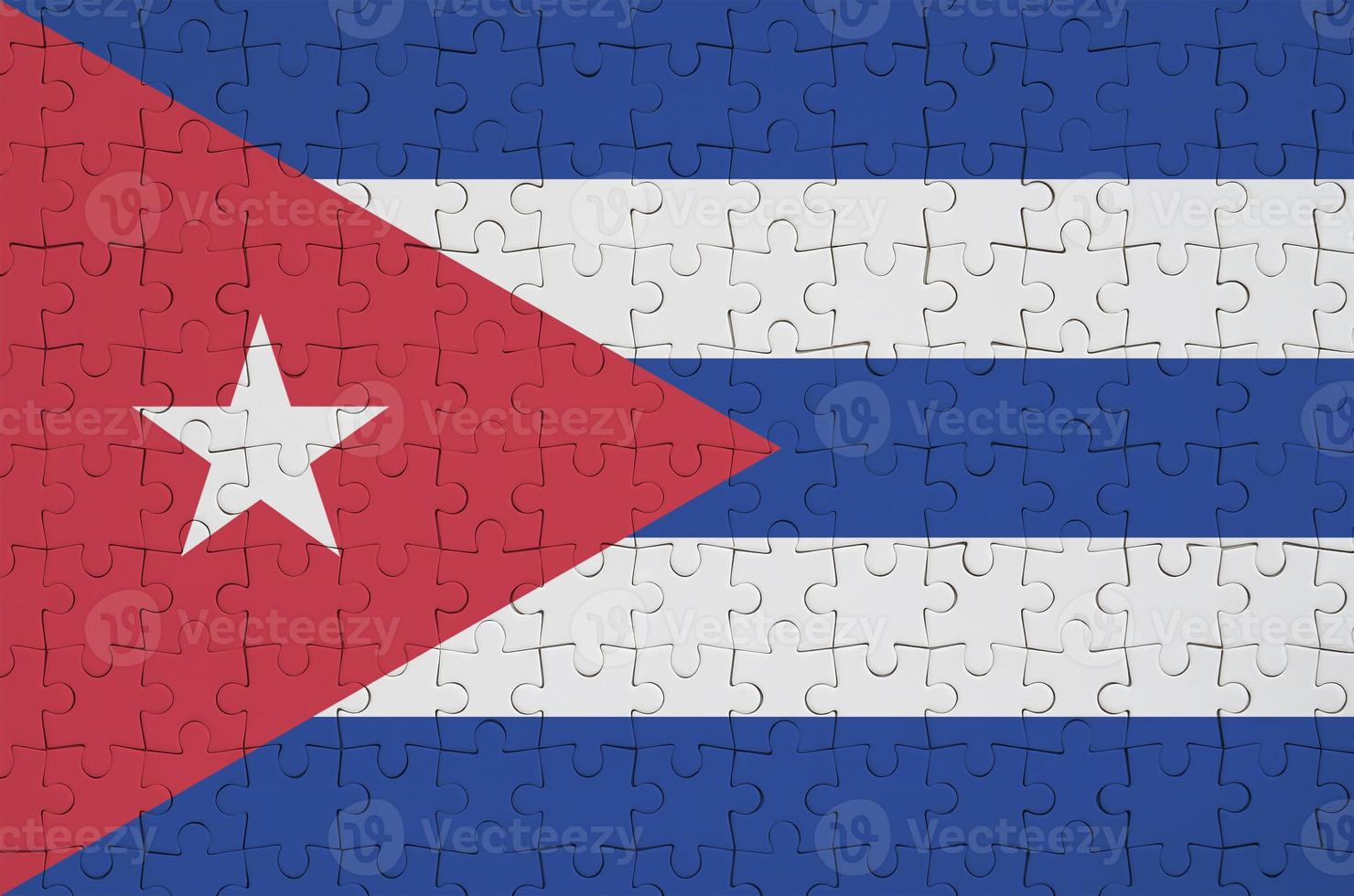 Cuba flag  is depicted on a folded puzzle photo
