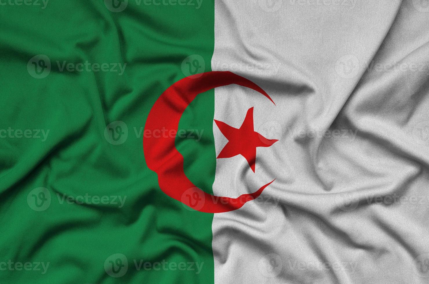 Algeria flag  is depicted on a sports cloth fabric with many folds. Sport team banner photo