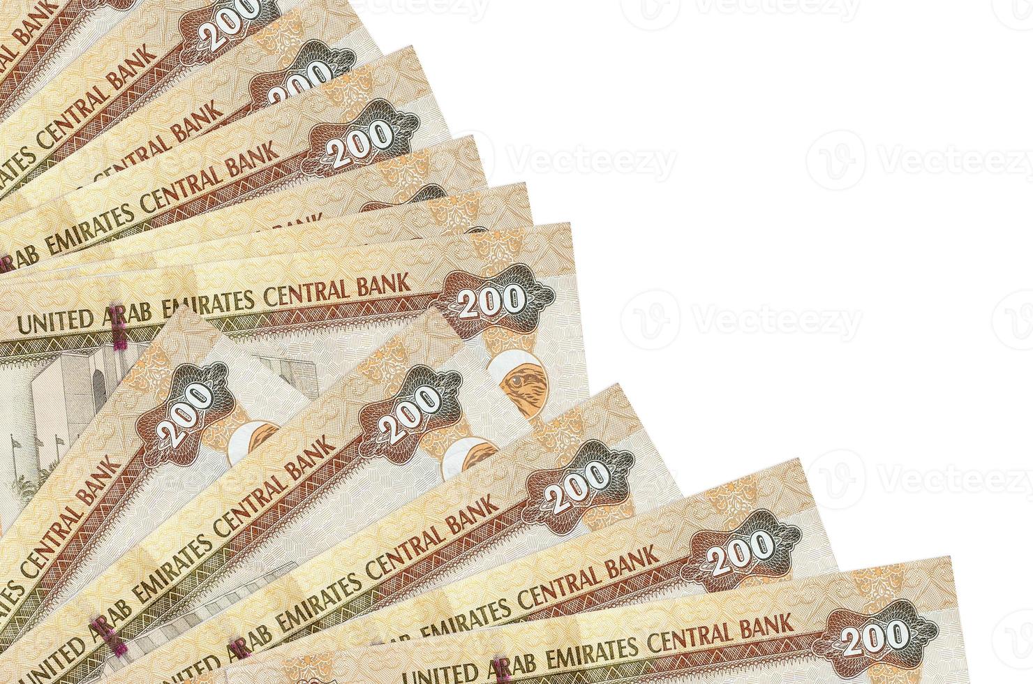 200 UAE dirhams bills lies isolated on white background with copy space stacked in fan close up photo