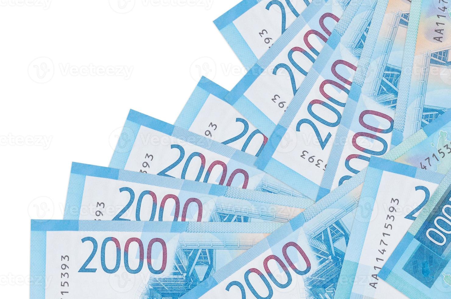 2000 russian rubles bills lies in different order isolated on white. Local banking or money making concept photo