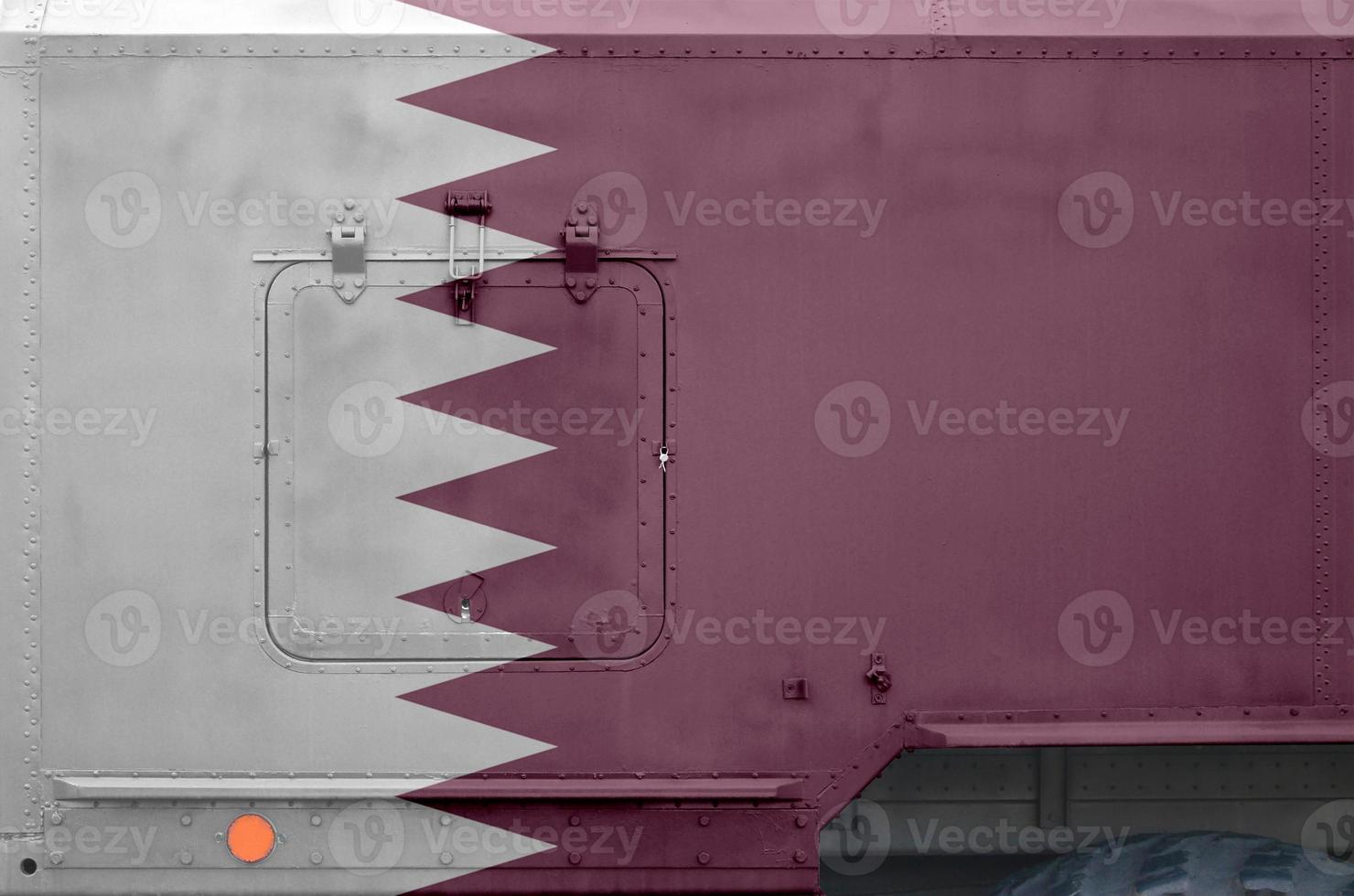 Qatar flag depicted on side part of military armored truck closeup. Army forces conceptual background photo