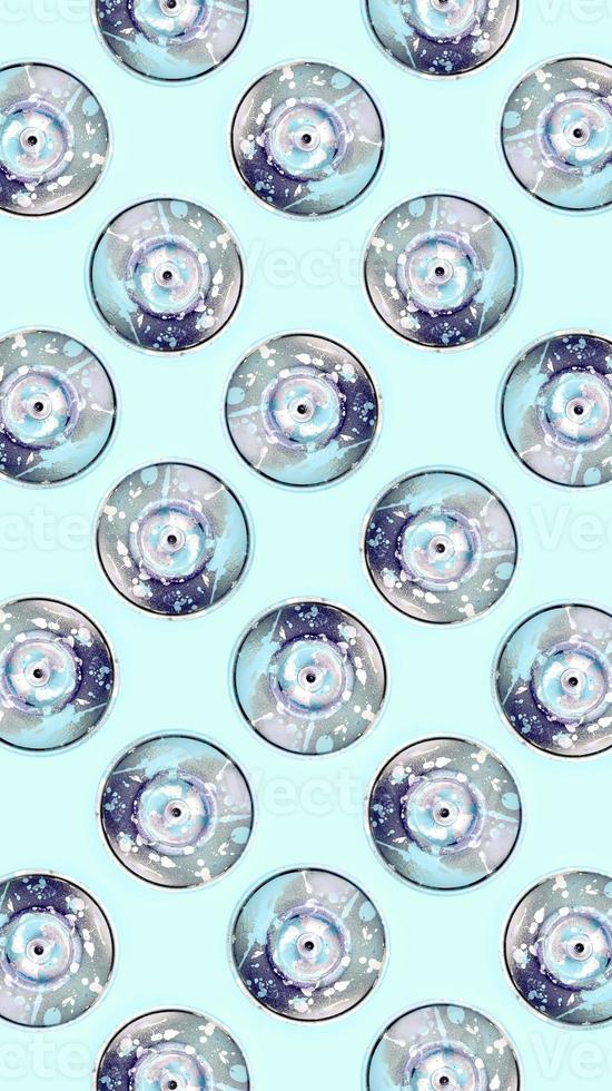 Many used spray cans for graffiti drawing lies on a pastel colored backgroung. Street art painting concept. Minimal flat lay pattern. Top view photo