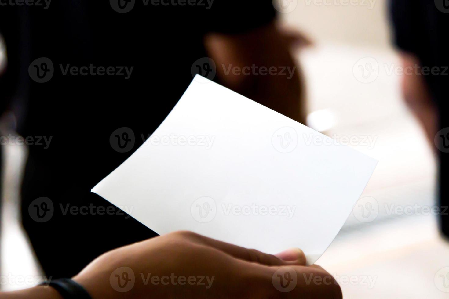 A man with a hand at a postcard with clipping path postcard photo