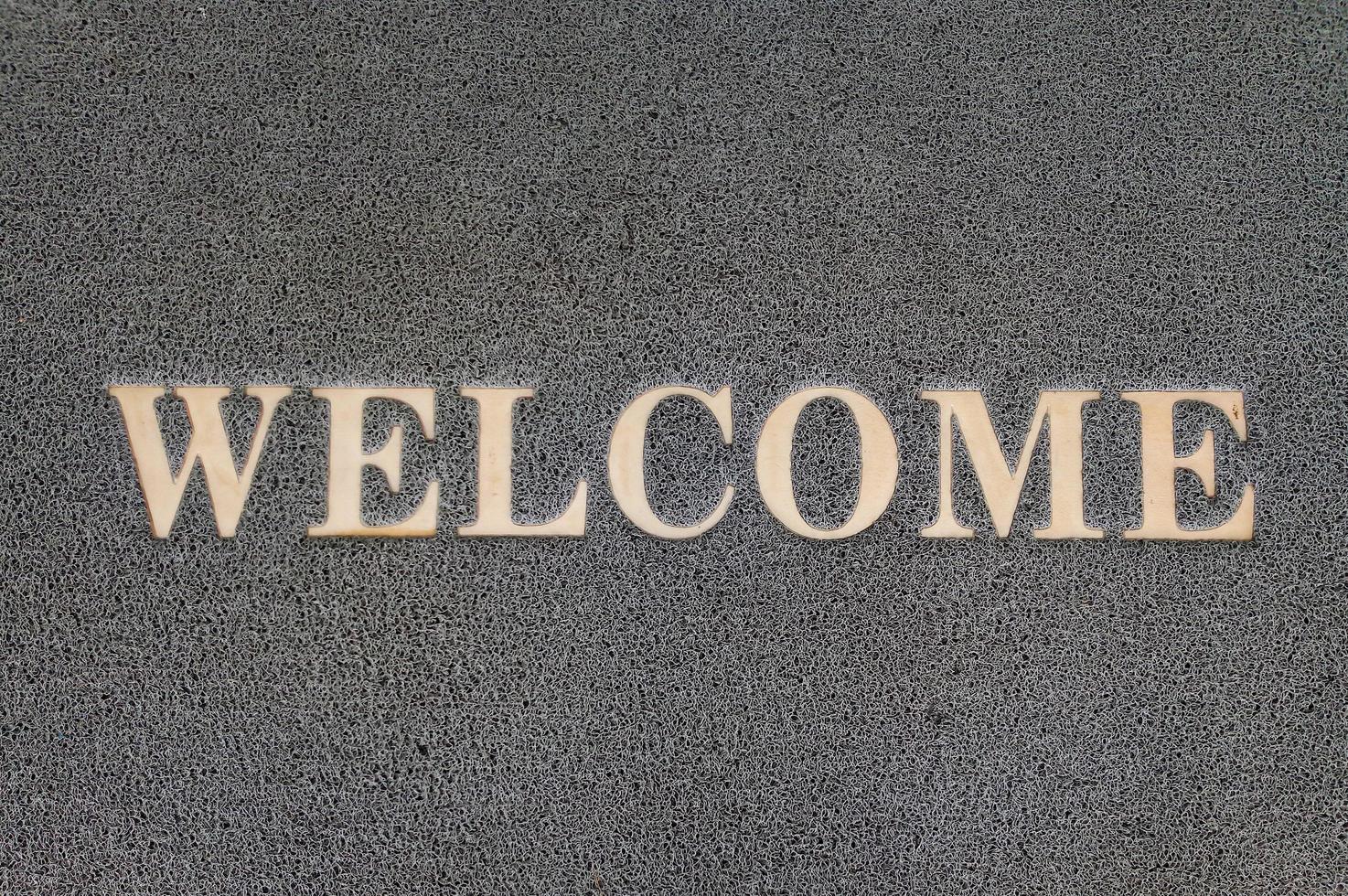 Overhead view of welcome mat outside photo