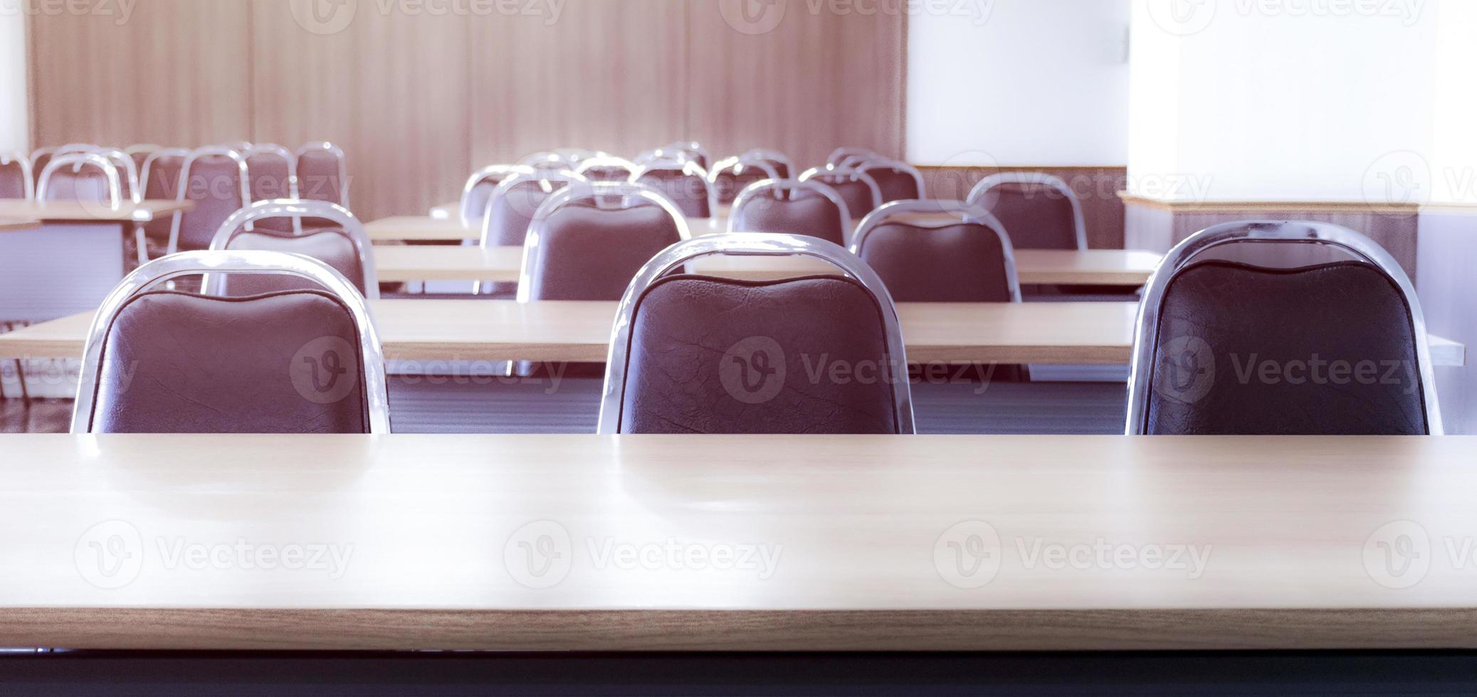 Close up three chair row in seminar room photo