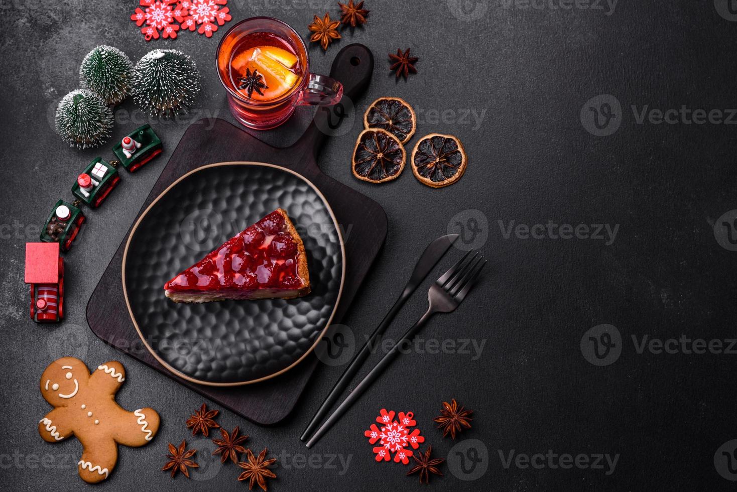 Homemade tasty cheesecake with jelly and raspberry berries on a black plate photo