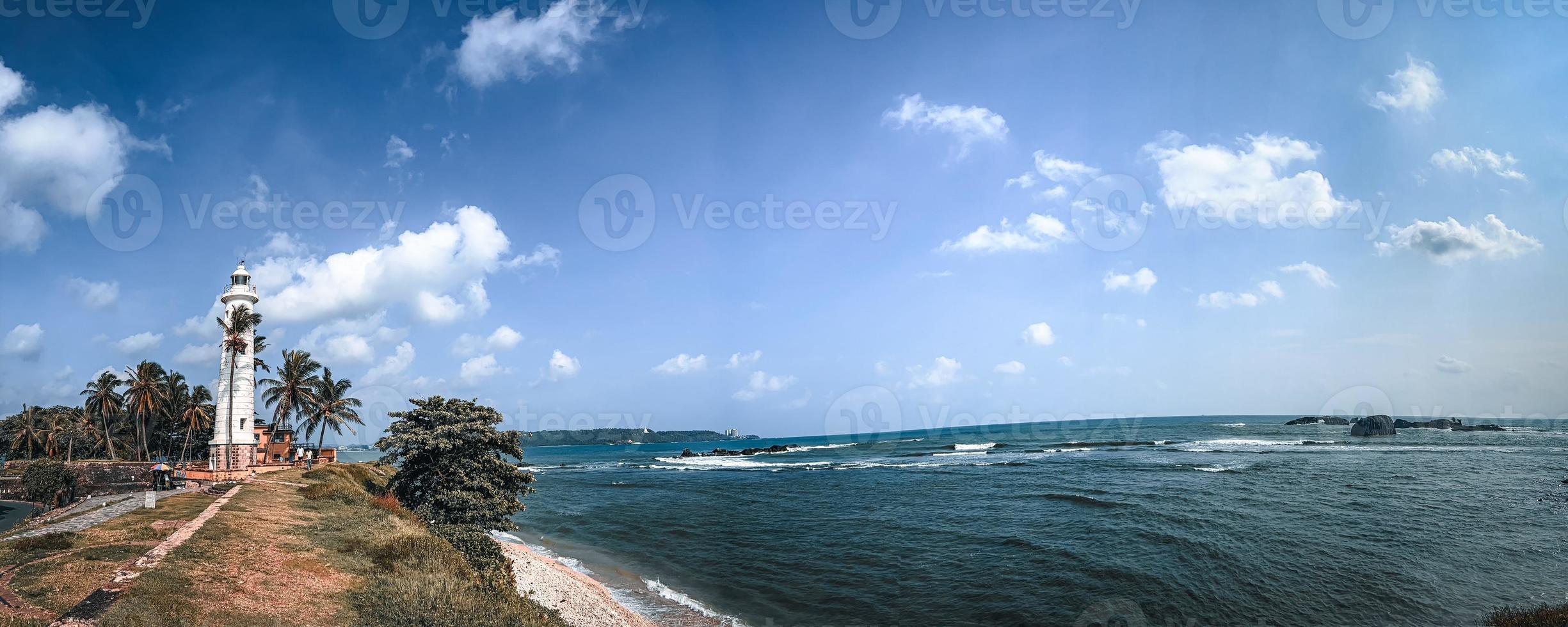 Lighthouse near sea. photo