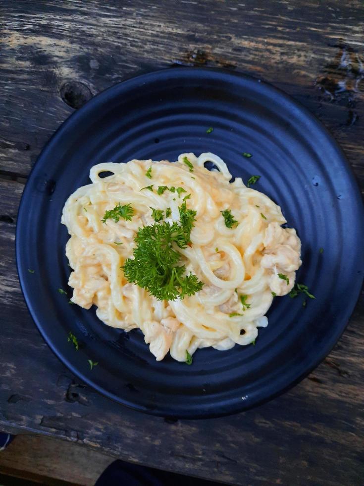 Spaghetti carbonara with egg and pancetta photo