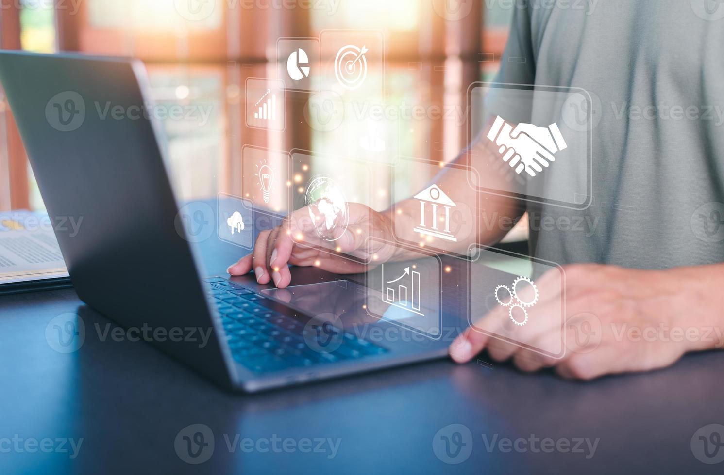 Business people work through laptops, virtual icons representing big data concepts, cyberspace technology and internet network databases, innovative connections and communications around the world. photo