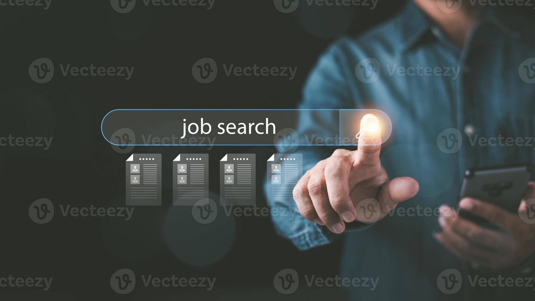 man pointing at icon Displays online job search information, career search ideas, recruitment, HR search, form websites and job applications,employment management of agencies with Internet technology photo