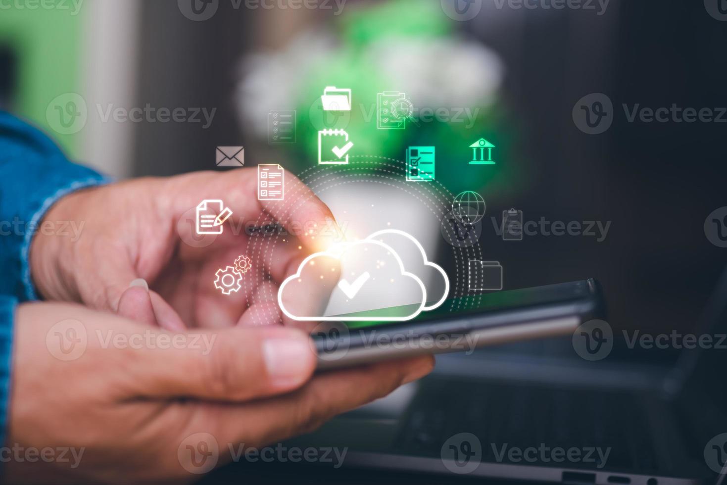 Human hand touches the smartphone, the concept of transferring, uploading, and downloading data, cloud computing technology transformation, online storage, large data backup and transmission. photo