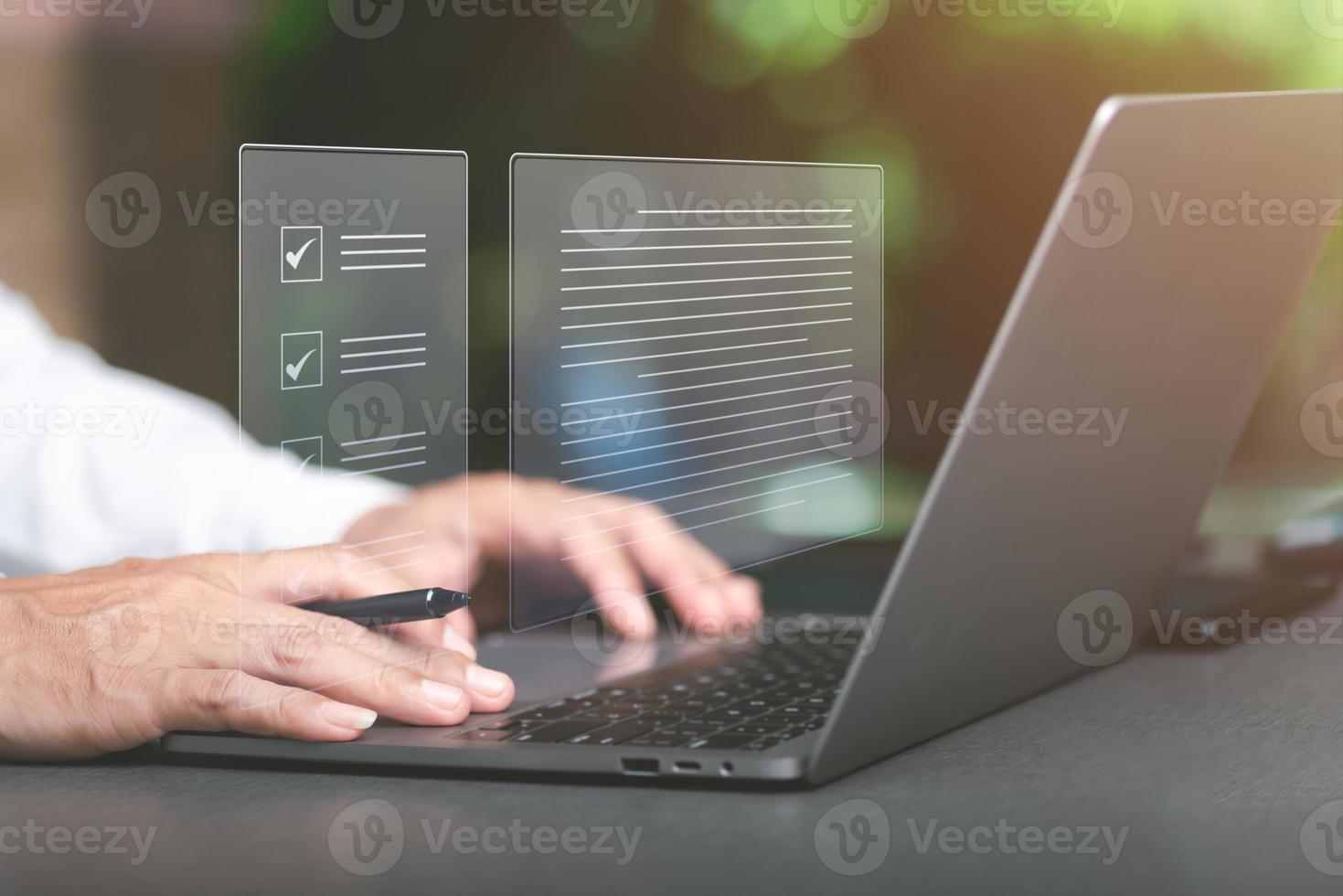 Businessman marks and checks documents online via laptop Concept of rules, rules and policies, company regulations. Terms and Conditions, and Legal Policies on Virtual Screens photo