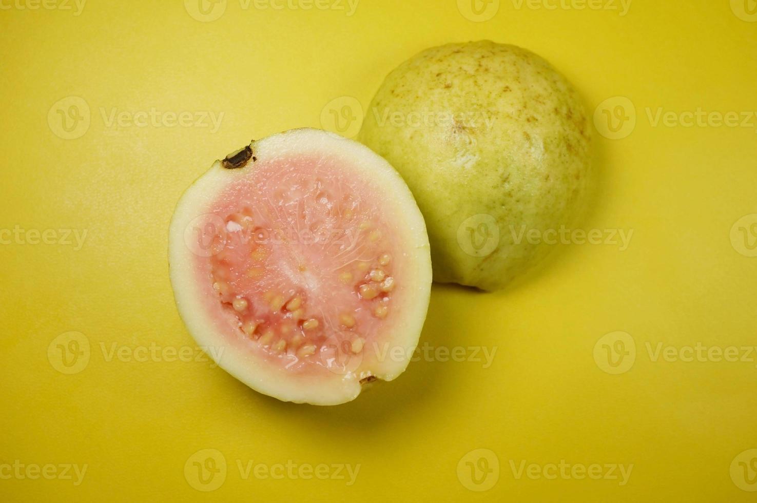 Guava fruit on yellow background with selective focus. photo