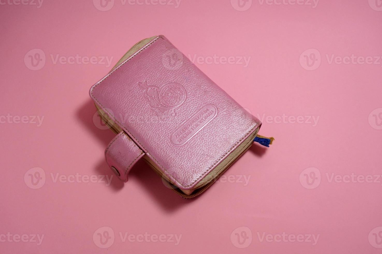 Al Quran Special For Woman. Pink Edition With Indonesia Translate. Quran is an Islamic holy book for muslim. photo