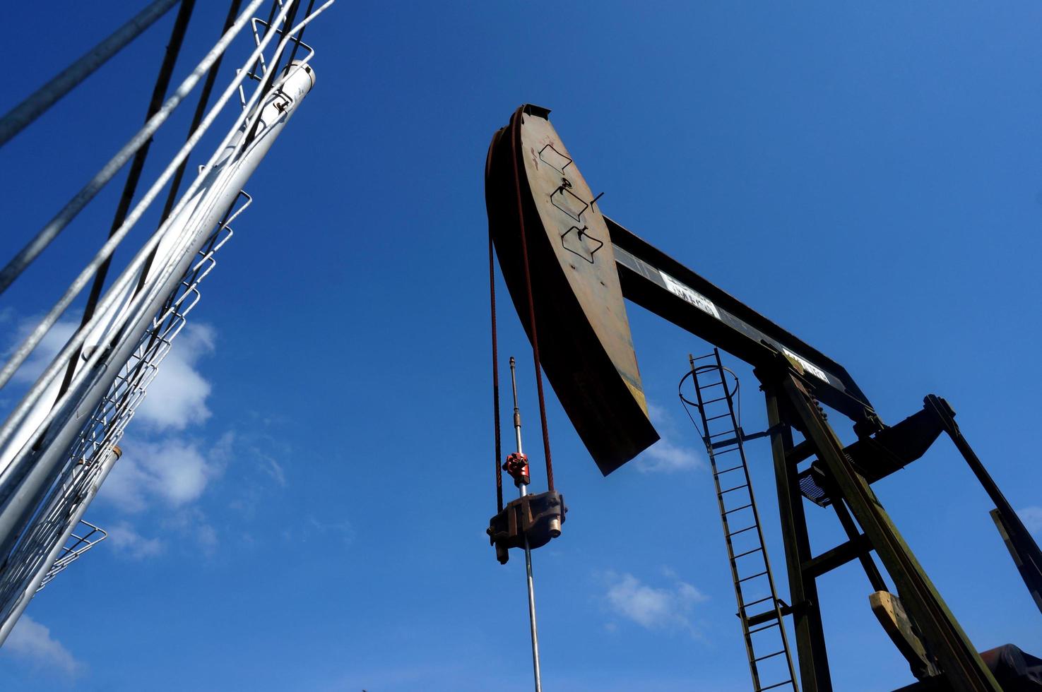 Sangatta, East Kalimantan, Indonesia, 2020 - A pumpjack is the overground drive for a reciprocating piston pump in an oil well. photo