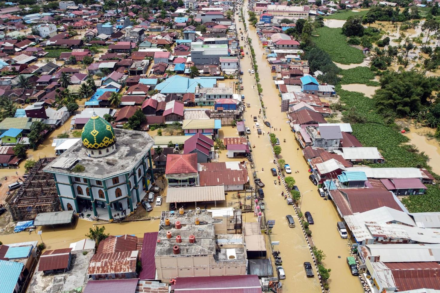 east kutai, east Kalimantan, Indonesia, 2022 - Aerial view of Situation Flood in . Floods hit homes and highways, disrupting transportation,  floods because high rainfall. photo