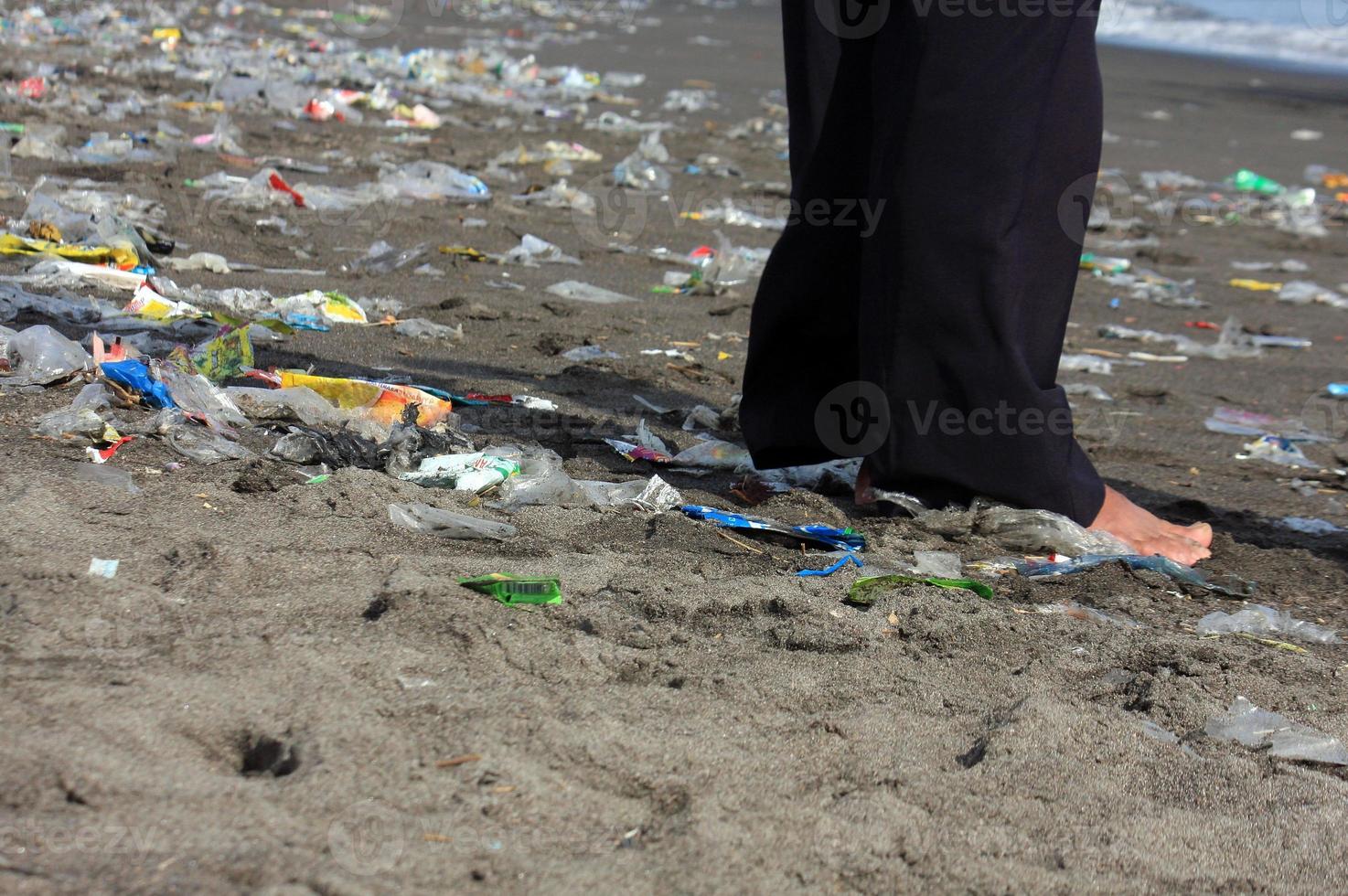Plastic trash on the beach after the new year's event. photo