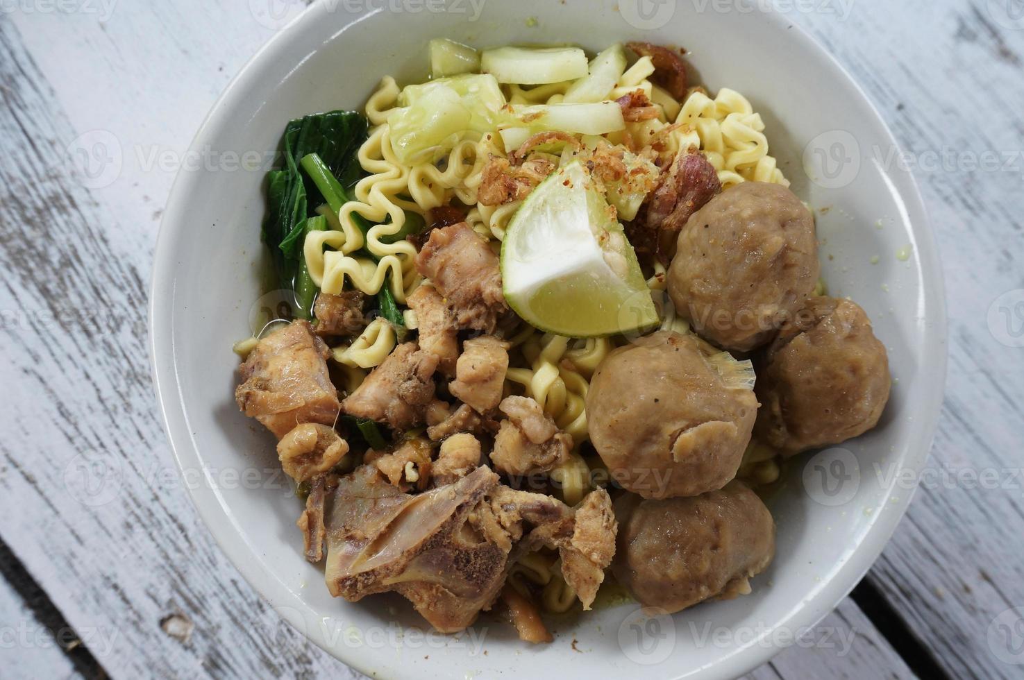 Chicken noodle soup  with meatball and vegetable photo