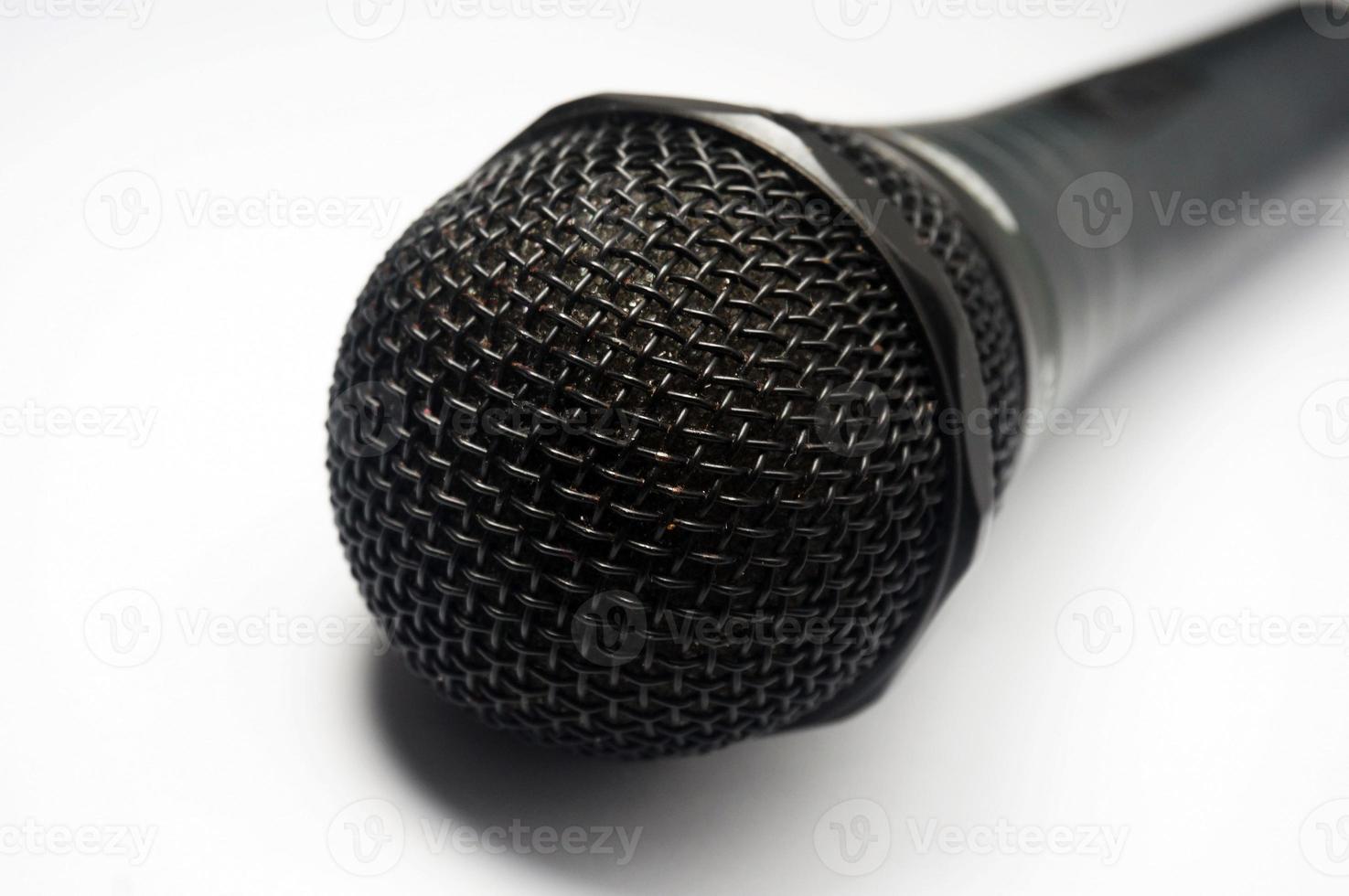 Black microphone head isolated on white background. photo