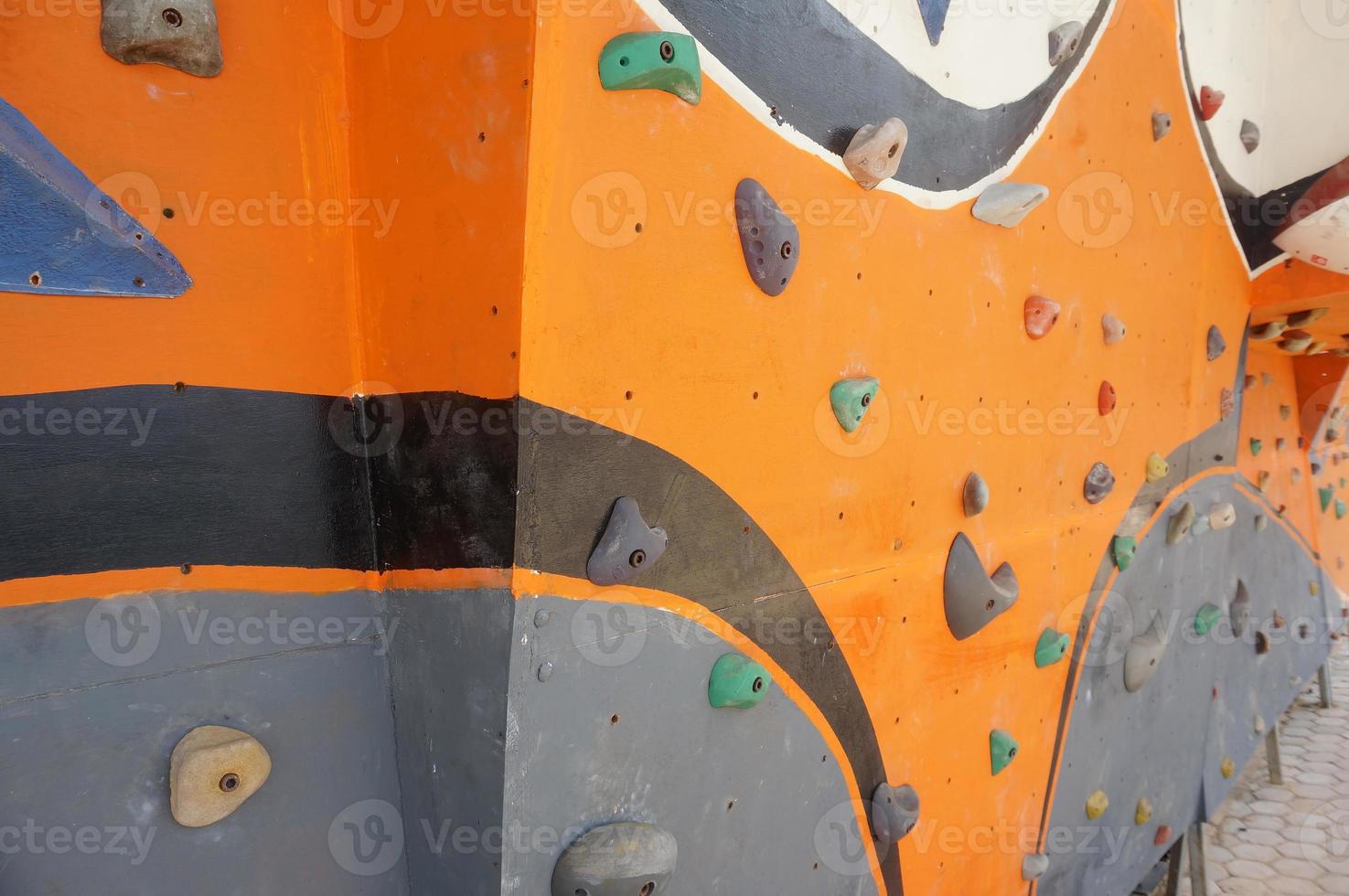 Stone hook on the artificial climbing wall at outdoor photo