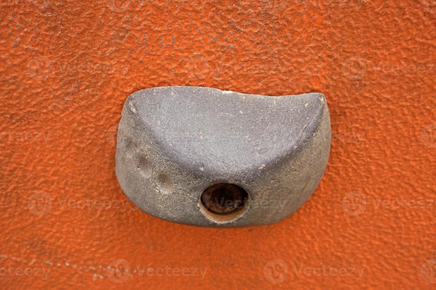 Stone hook on the artificial climbing wall at outdoor photo